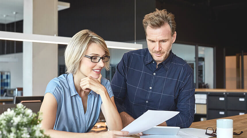 Business people looking at document