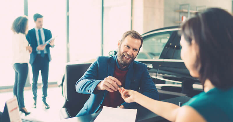 Businessman buying luxury car