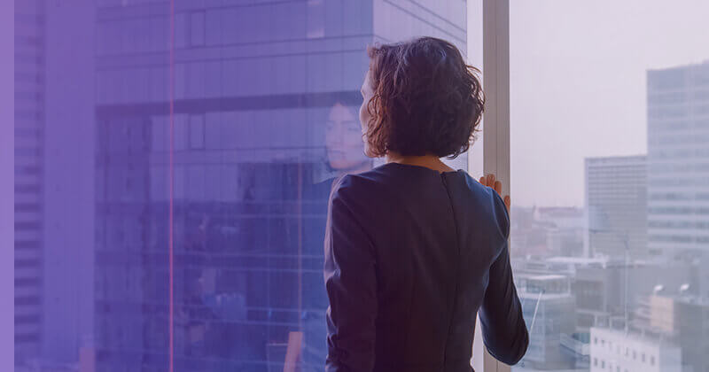 Businesswoman looking out office window