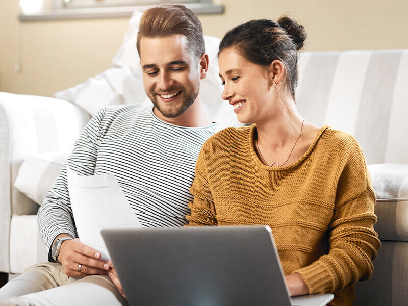 couple checking email on laptop