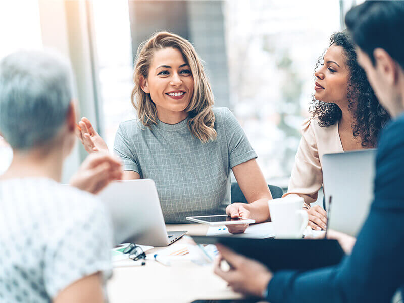 Group of business persons in discussion