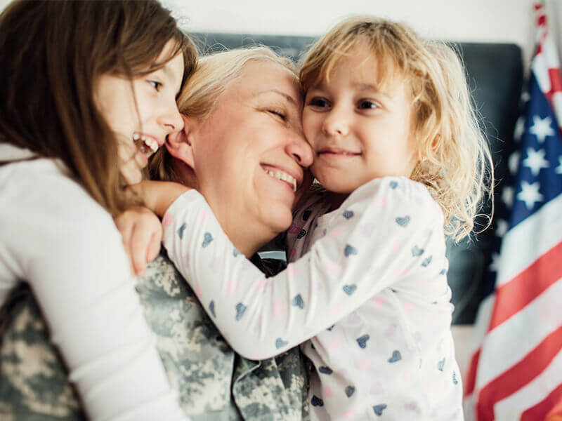 Military person is back home with children