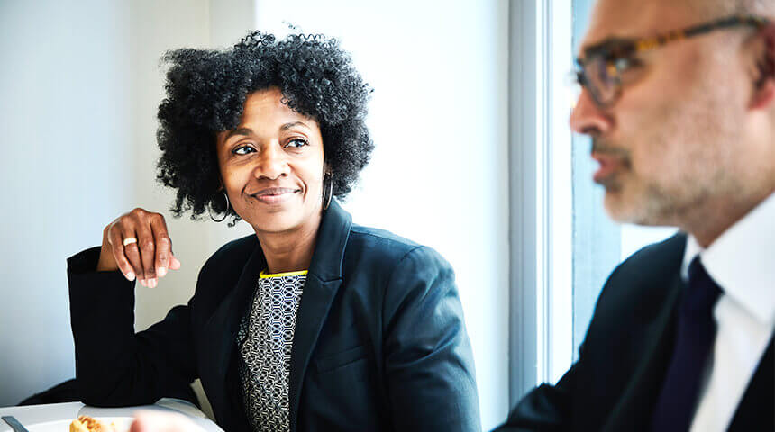 Smiling businesswoman in discussion