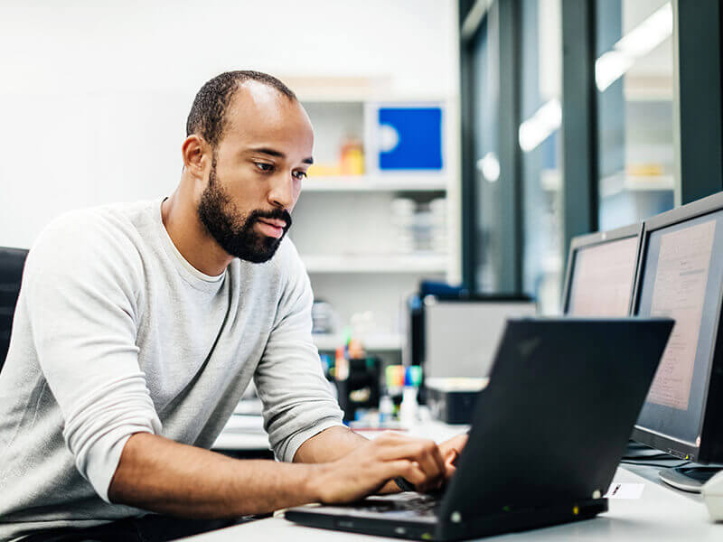 Team leader using computer in office