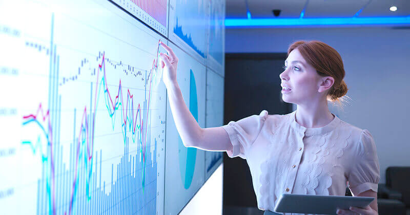 Woman reviewing analytics screen
